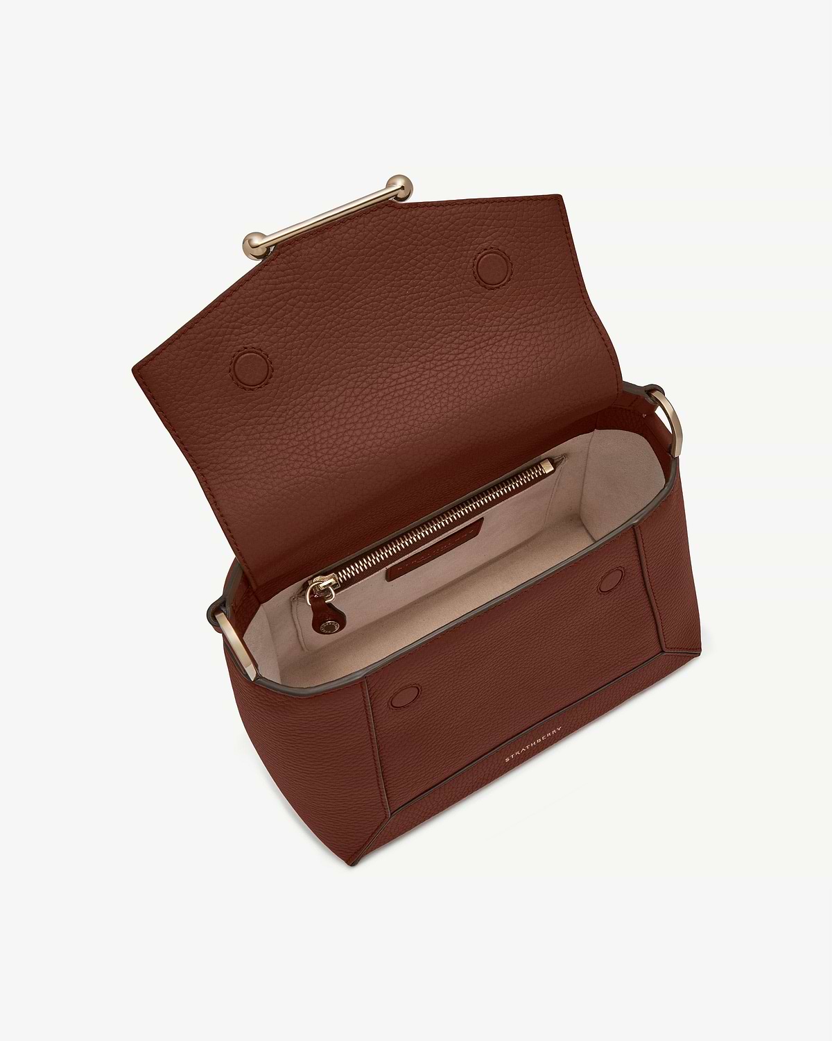 Walnut mosaic bag open, showing pebbled leather exterior and beige interior with zip pocket.
