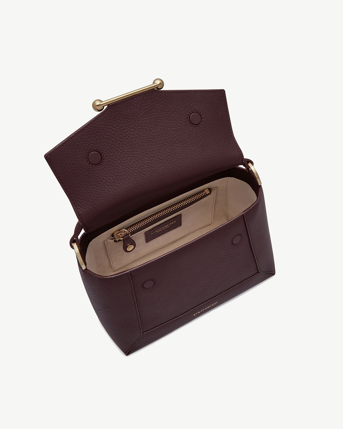 Burgundy Strathberry mosaic bag with open flap, beige interior and zip pocket.