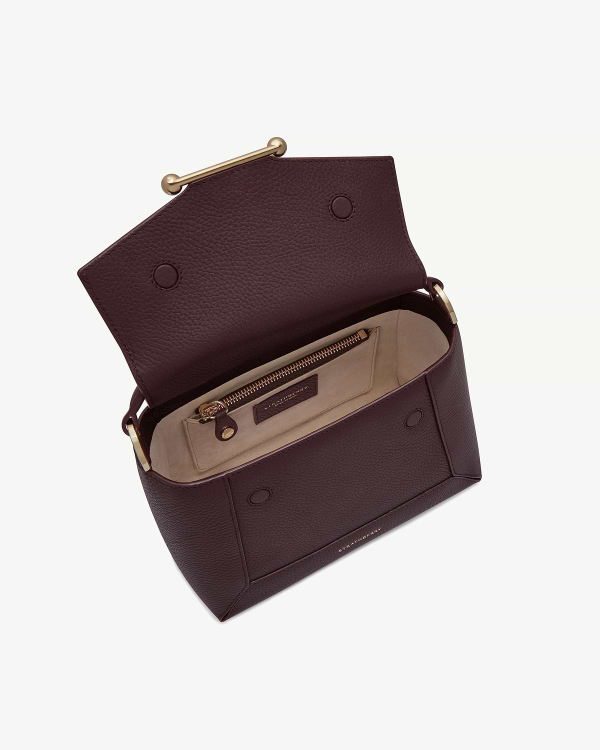 Burgundy Strathberry mosaic bag with open flap, beige interior and zip pocket.