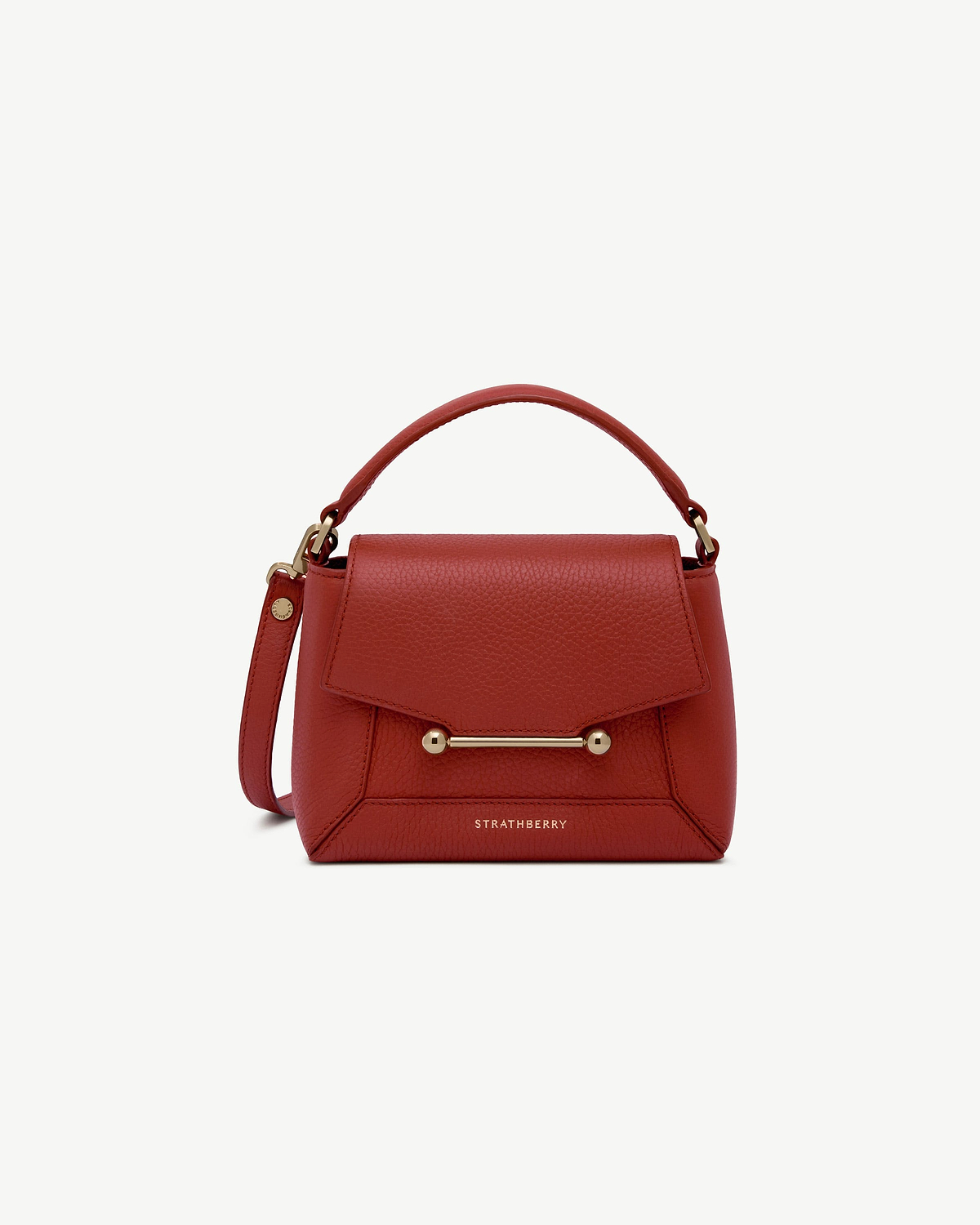 Strathberry leather bag in Levanto red with top handle and gold bar detail.