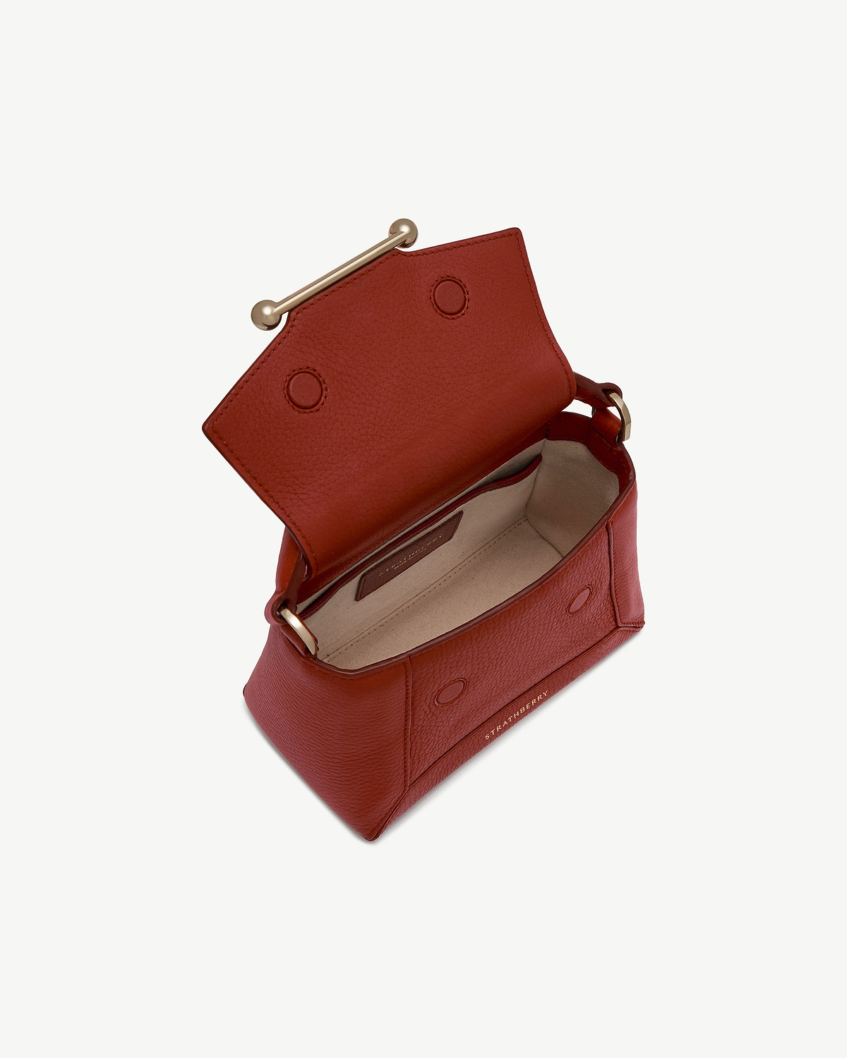 Strathberry Mosaic Nano in Levanto red, open flap showing beige interior.