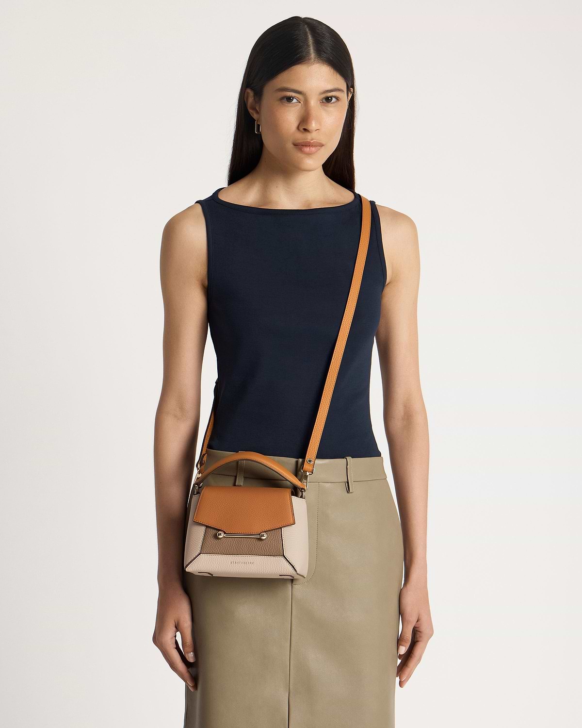 Model wearing Strathberry Mosaic Nano crossbody bag in oat, honey and clay.