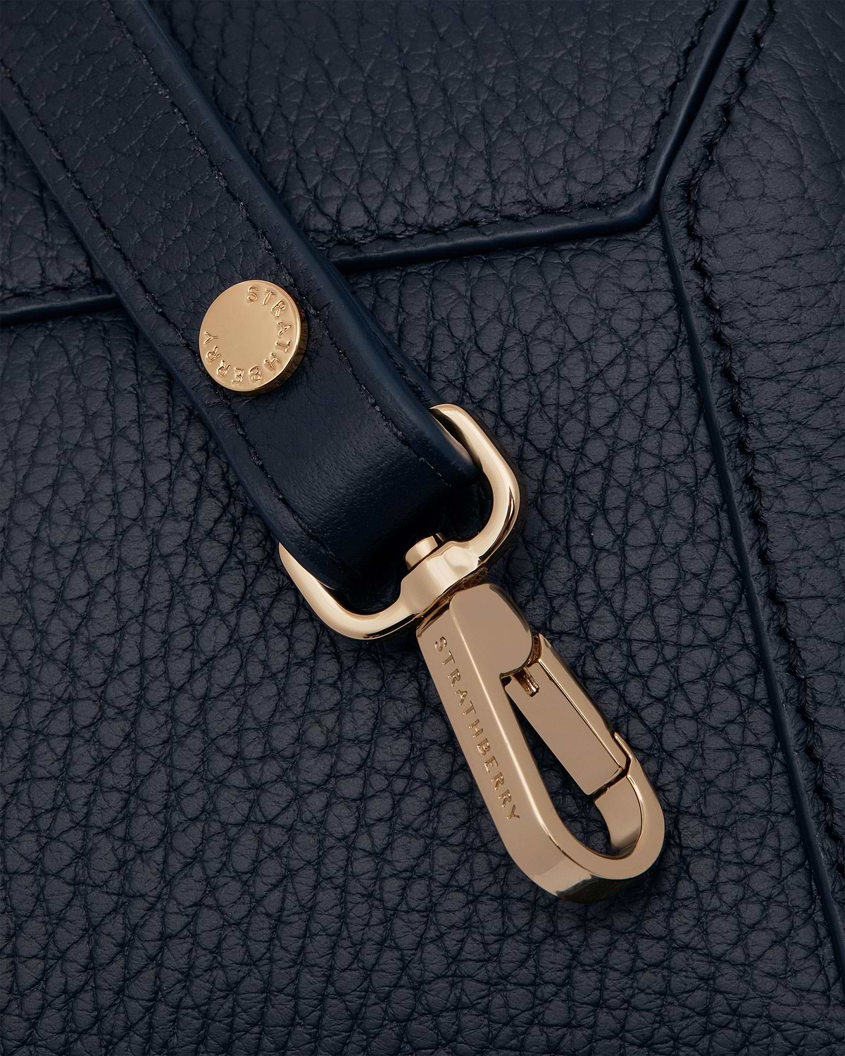 Navy Mosaic Nano leather with gold Strathberry clasp and pebbled texture