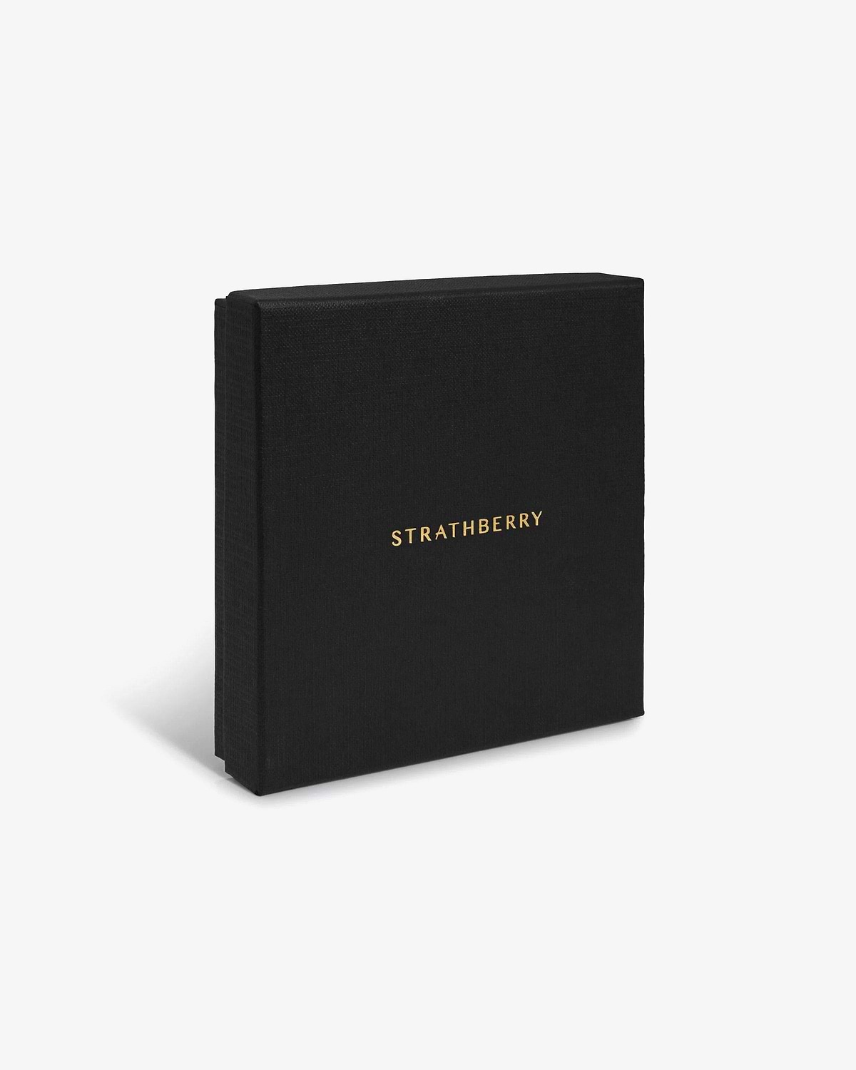 Black textured Strathberry box with gold logo, upright on a white background.