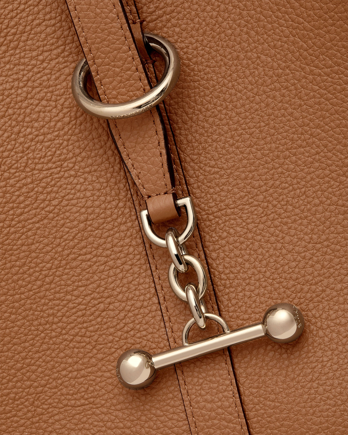 Tan leather tote strap with chain links and Strathberry engraved metal hardware.