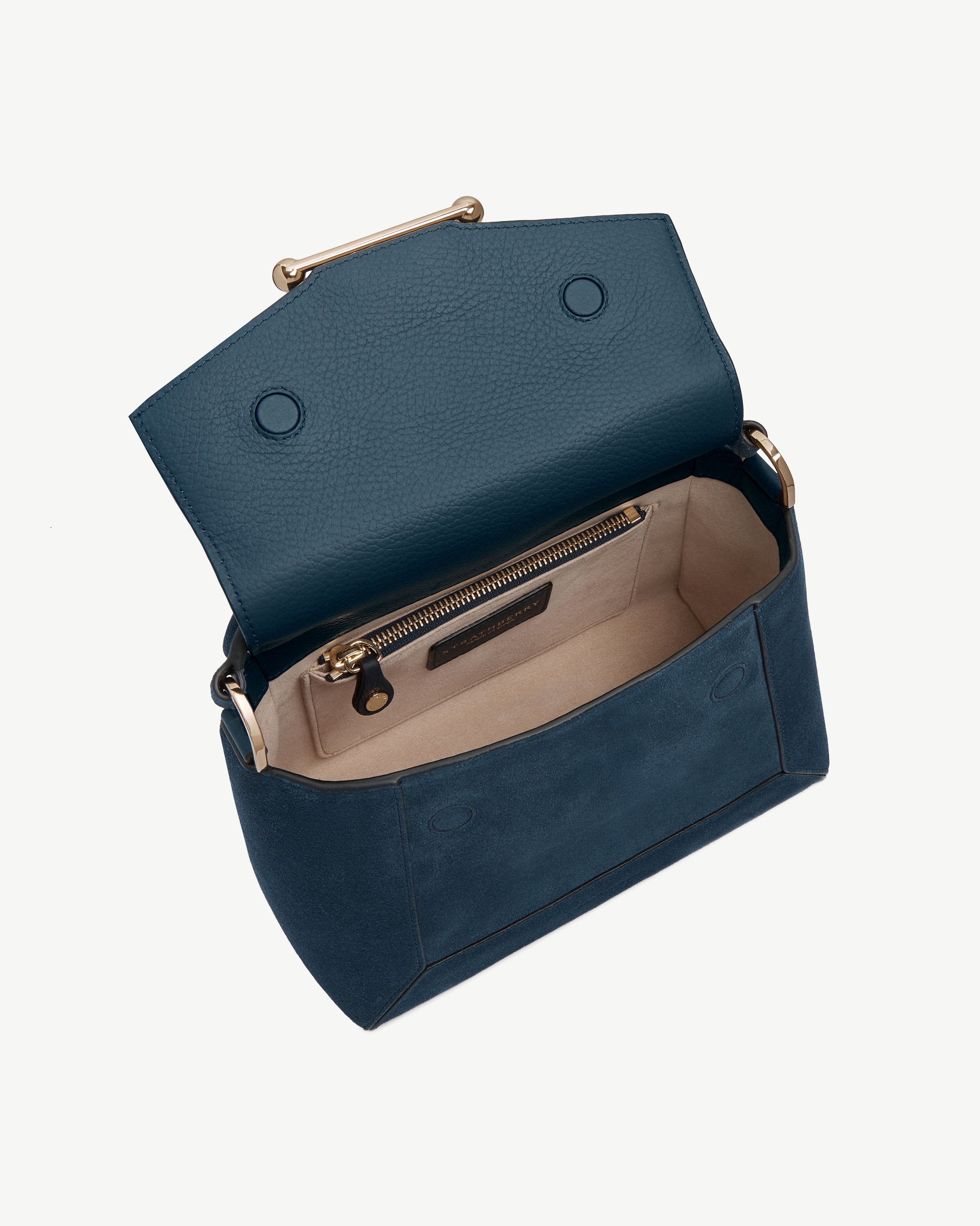 Open mosaic bag in loch blue suede showing flap, magnetic closures, and interior pocket