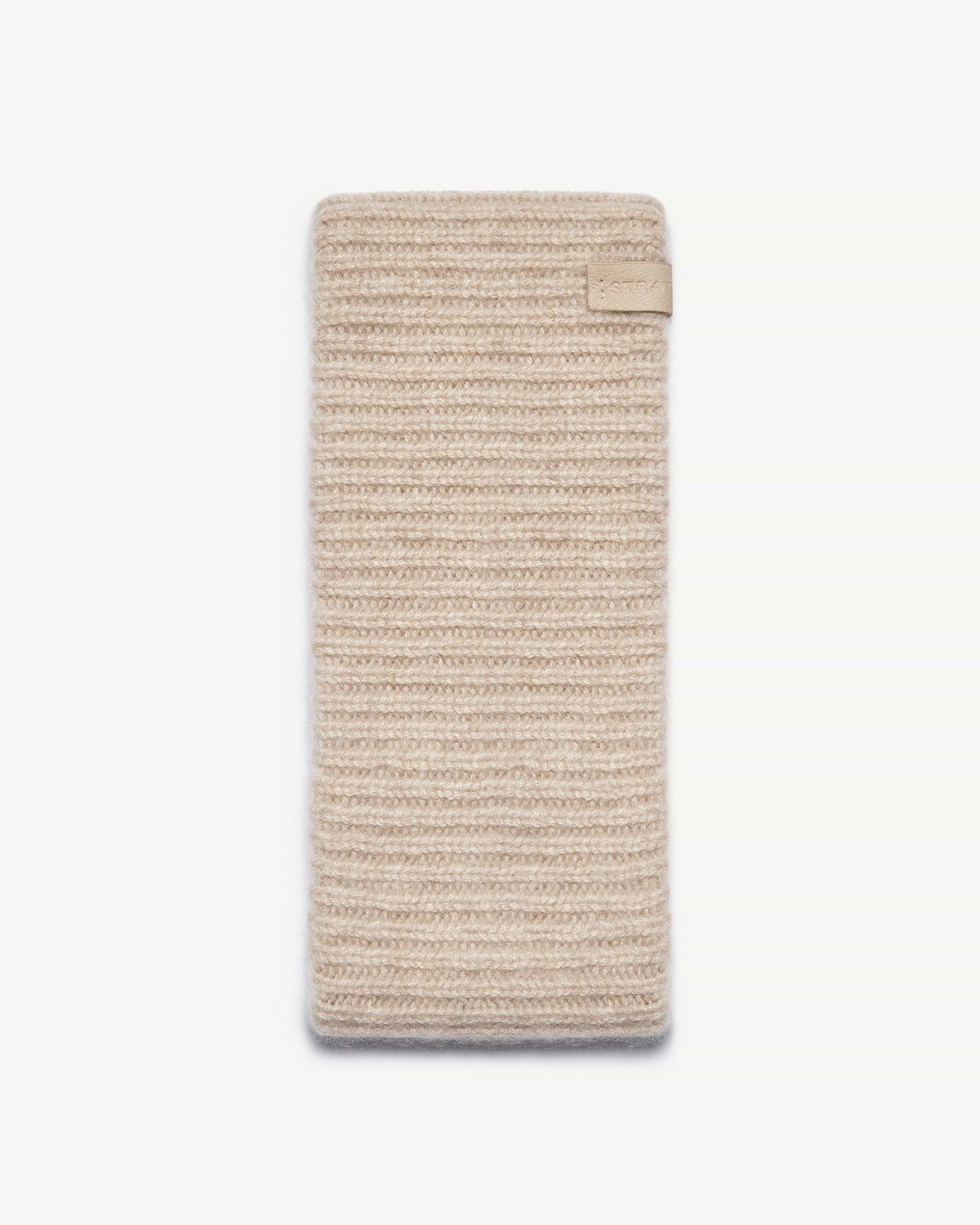 Ribbed cashmere headband in oat, rectangular knit with small leather tab.