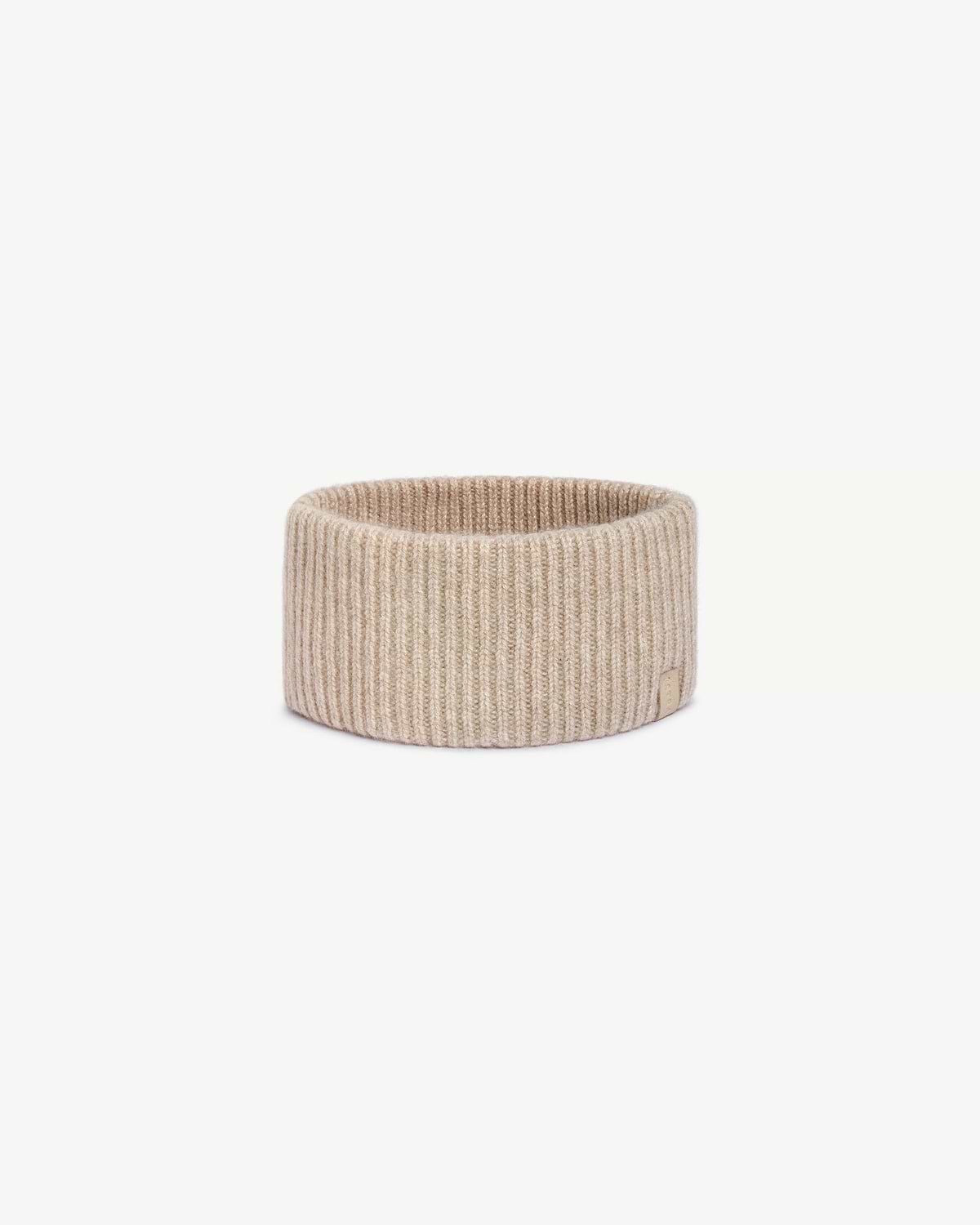 Oat ribbed cashmere headband on white background, top opening visible.