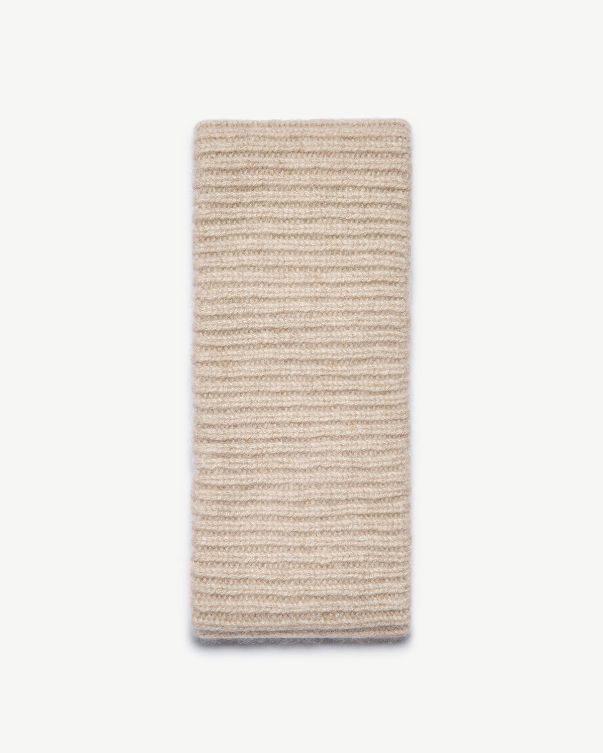 Ribbed cashmere headband in oat laid flat on white background.