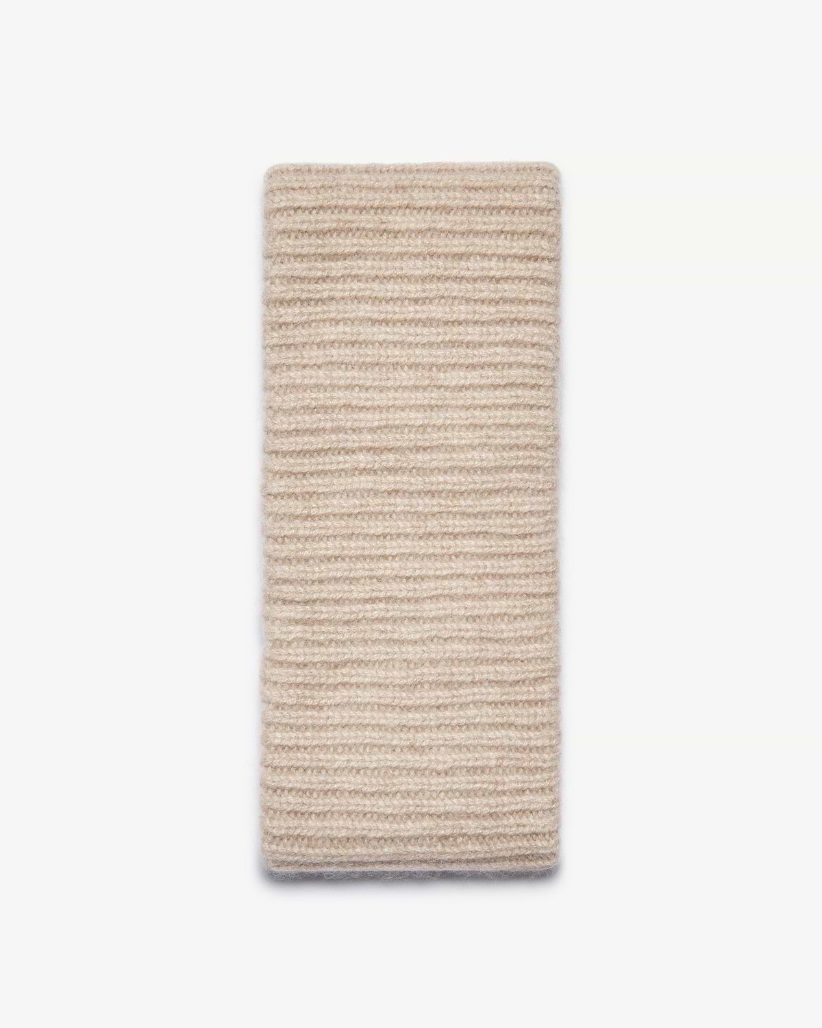 Ribbed cashmere headband in oat laid flat on white background.
