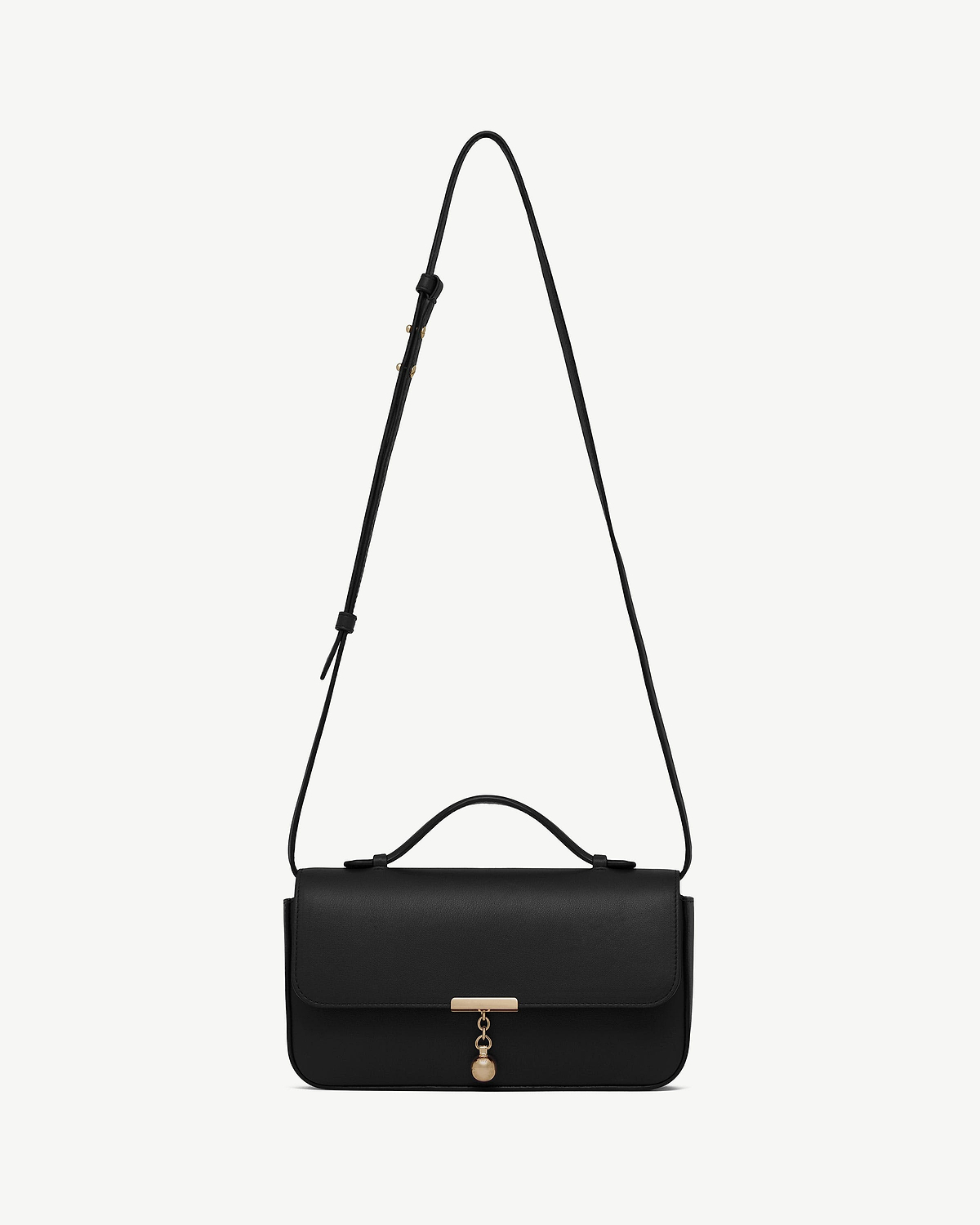 Black clutch with top handle, adjustable shoulder strap and gold clasp charm.