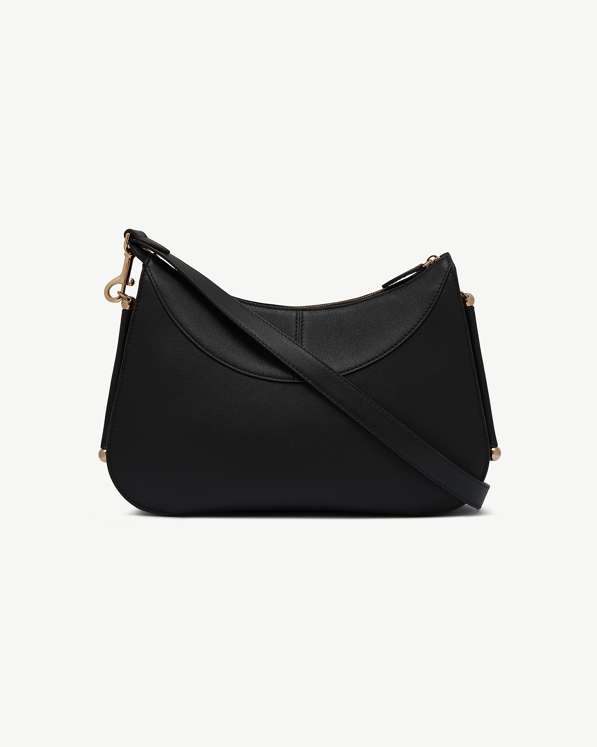 Black shoulder bag with curved top, cross-body strap and gold-tone hardware.