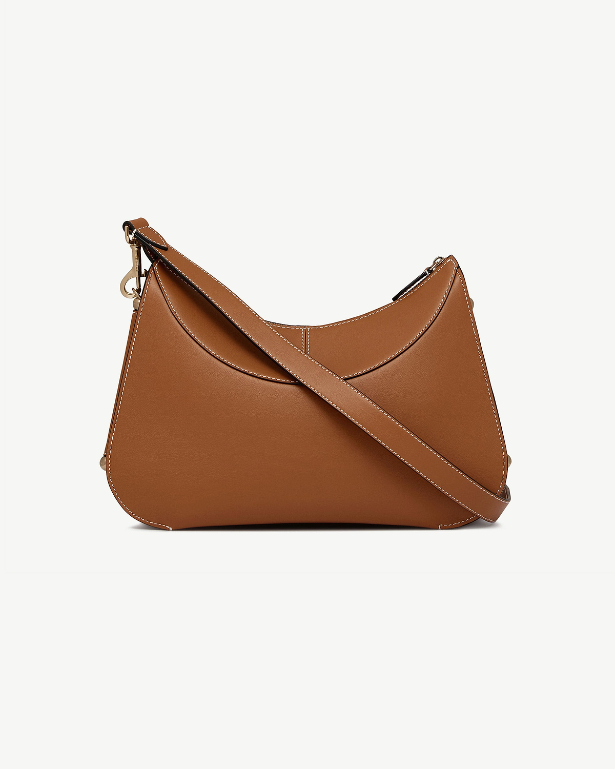 Tan leather Nest Shoulder bag with curved shape and contrast stitching.
