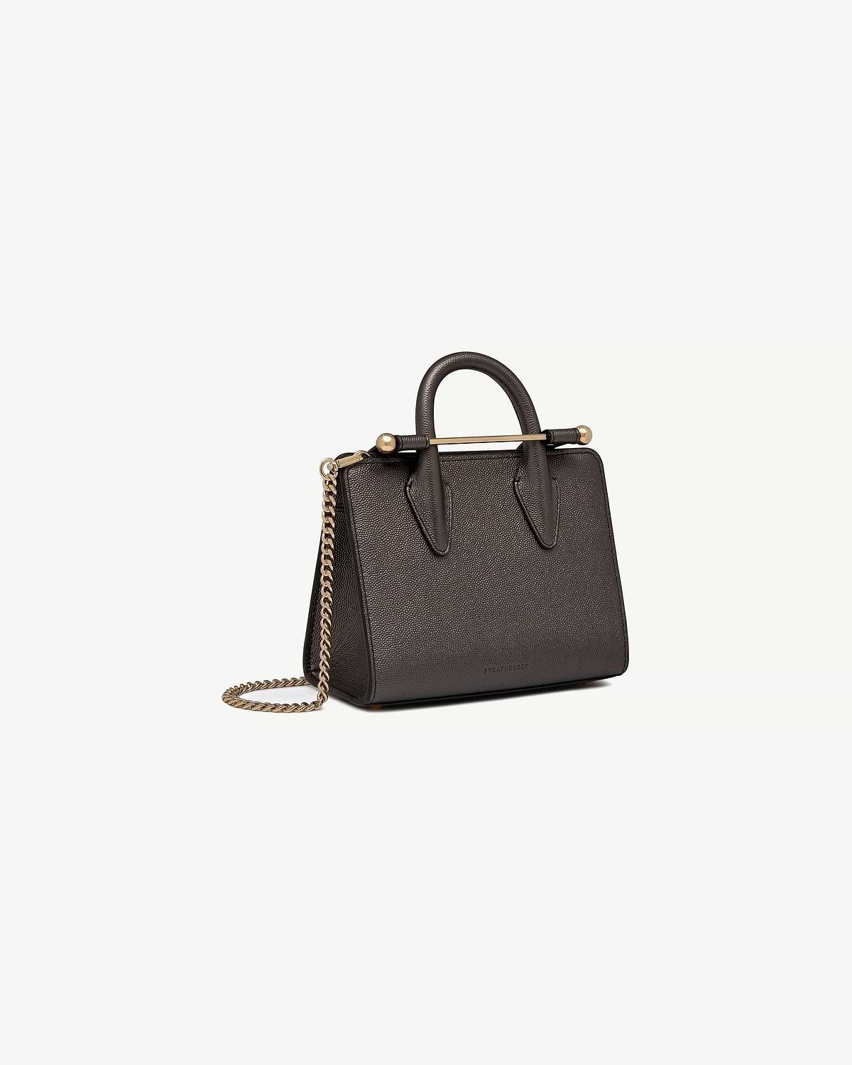 Strathberry nano tote in metallic anthracite caviar with top handles and gold chain strap