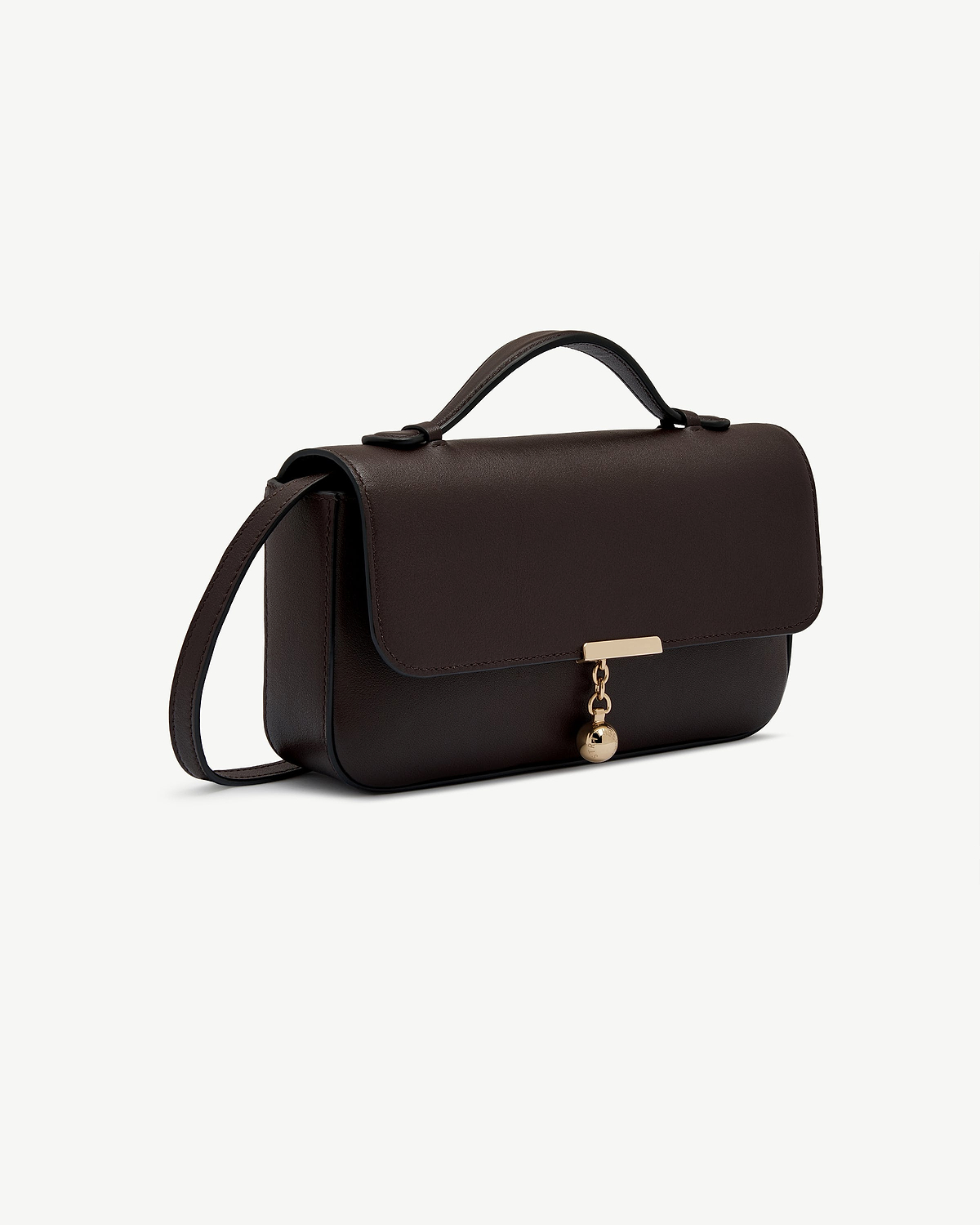 Espresso leather clutch with top handle and gold ball charm.