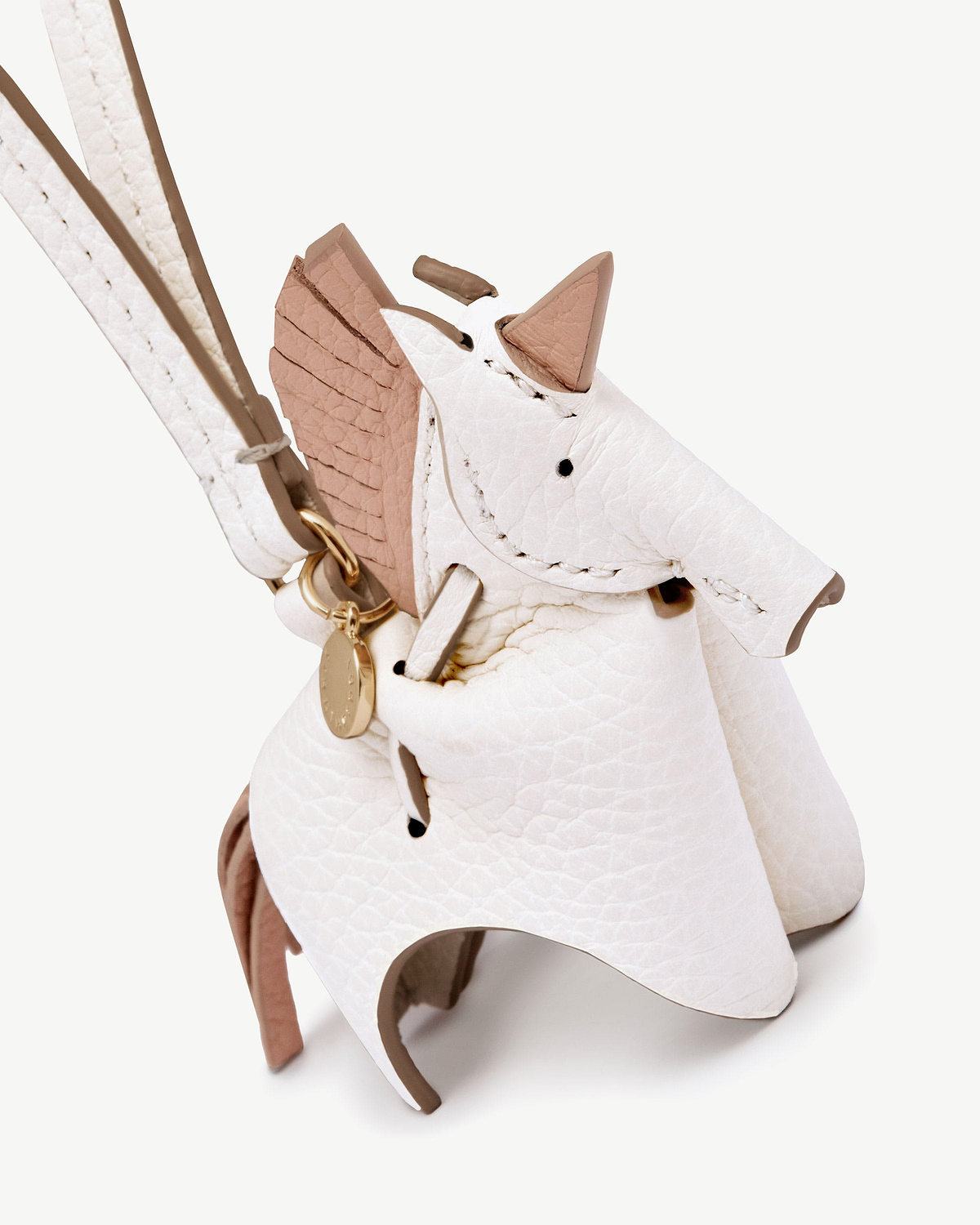 White and peony unicorn leather bag charm with gold ring and strap.