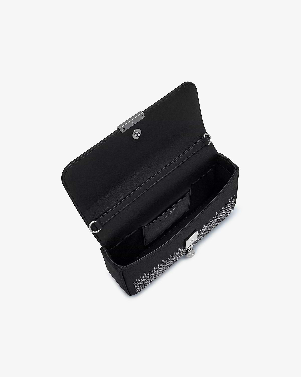 Open black embroidered satin clutch showing interior, strap rings and crystal embellishments.