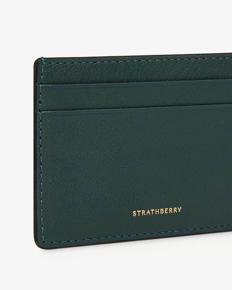 Bottle green leather cardholder corner with card slots and gold Strathberry logo