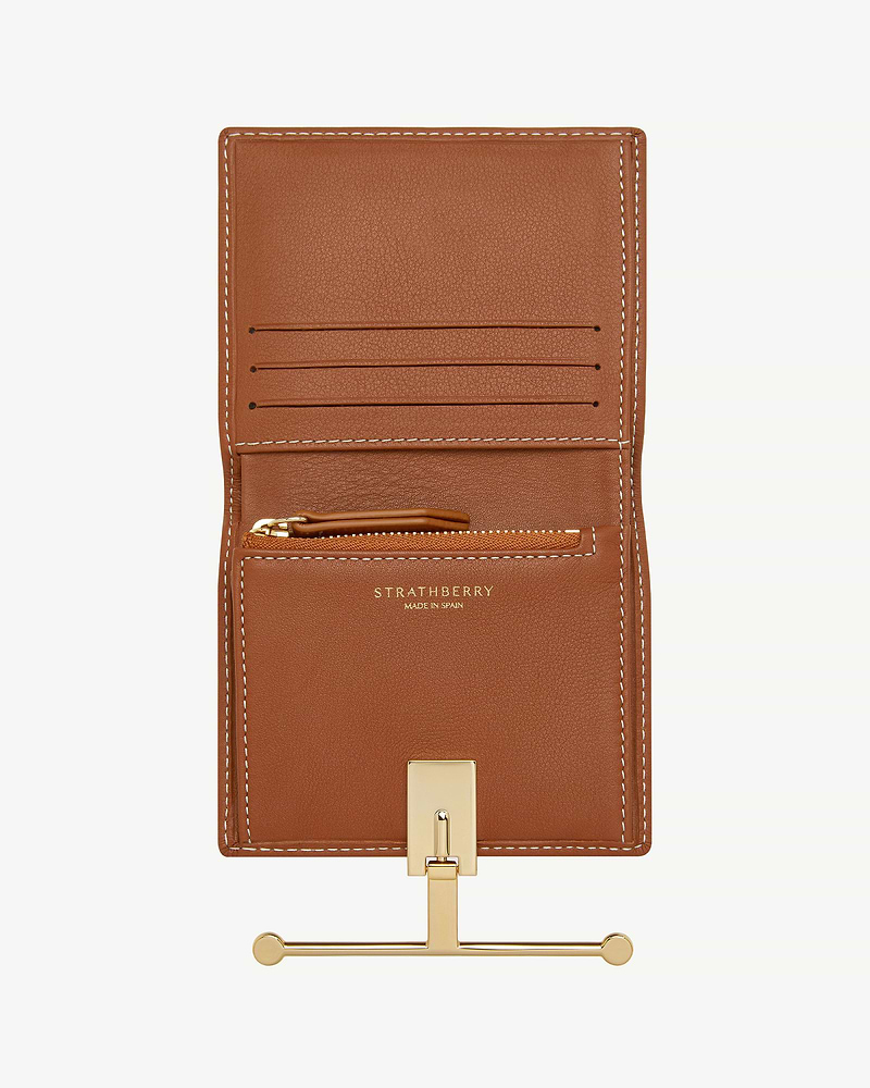 Strathberry Melville Street wallet in chestnut leather with vanilla stitching, open, gold clasp.