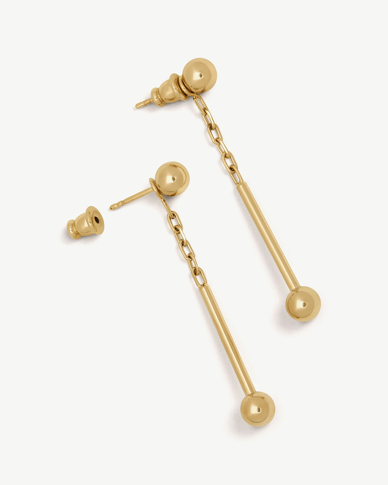 Pair of music bar drop earrings in 22-carat gold gilded finish with chain drops.
