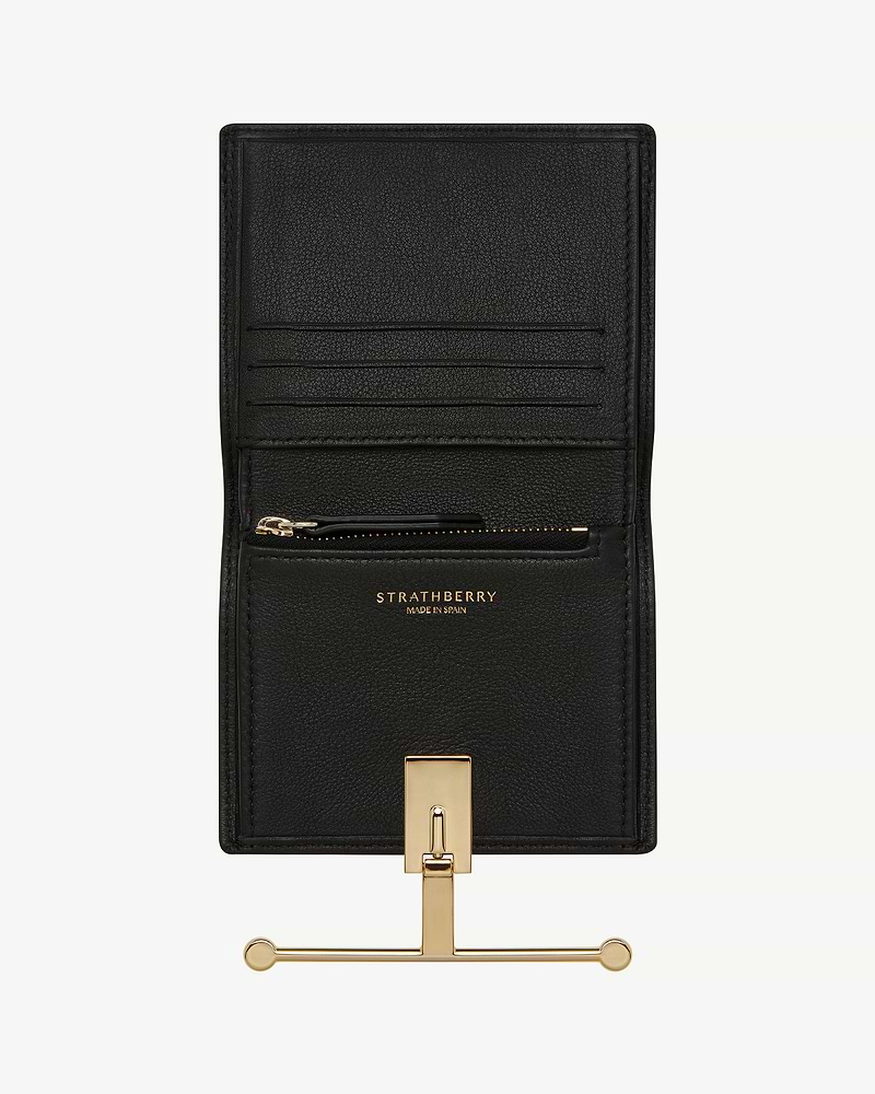Black Strathberry Melville Street wallet open showing card slots and gold hardware.