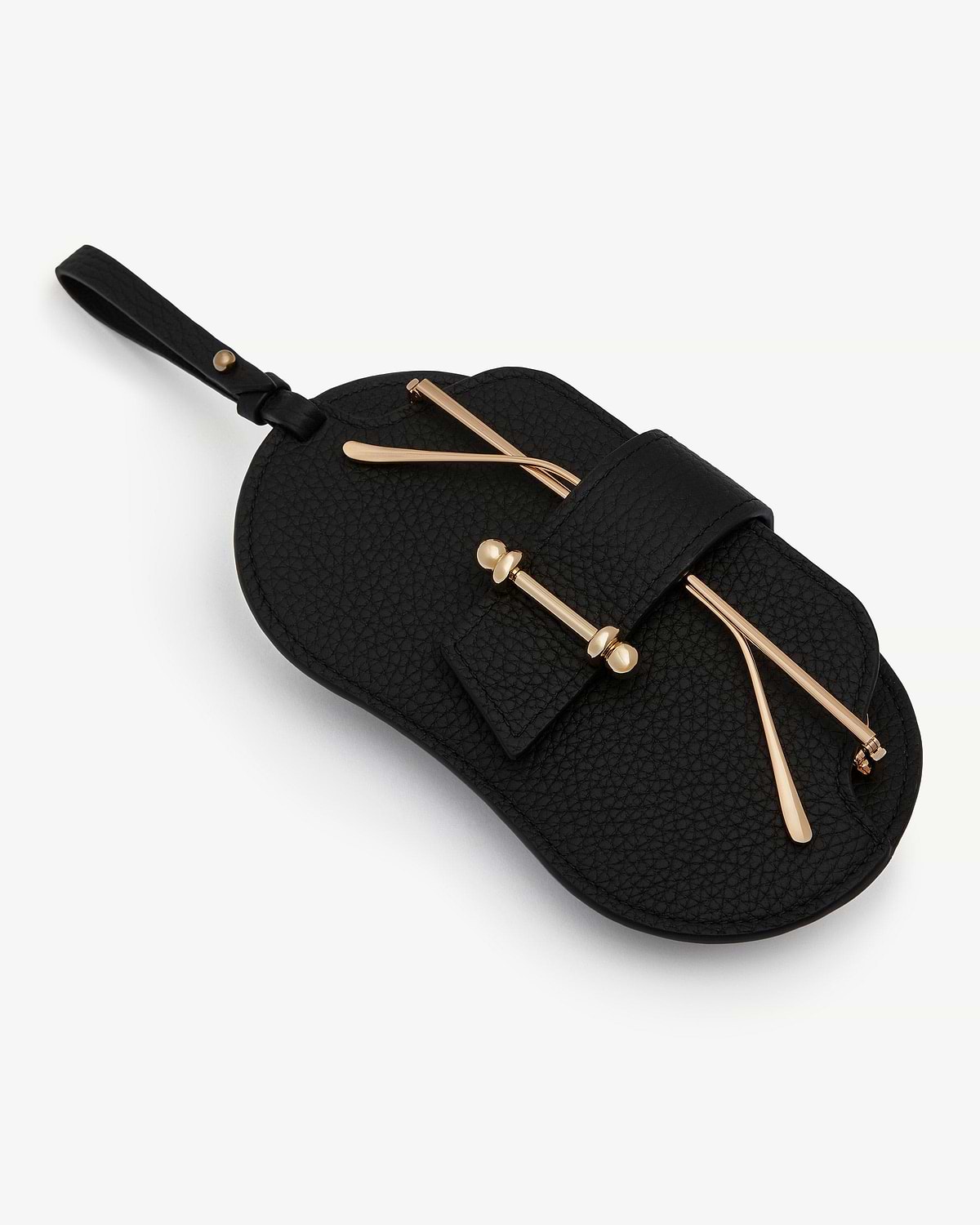 Black pebbled sunglasses case with strap and gold-tone bar hardware.