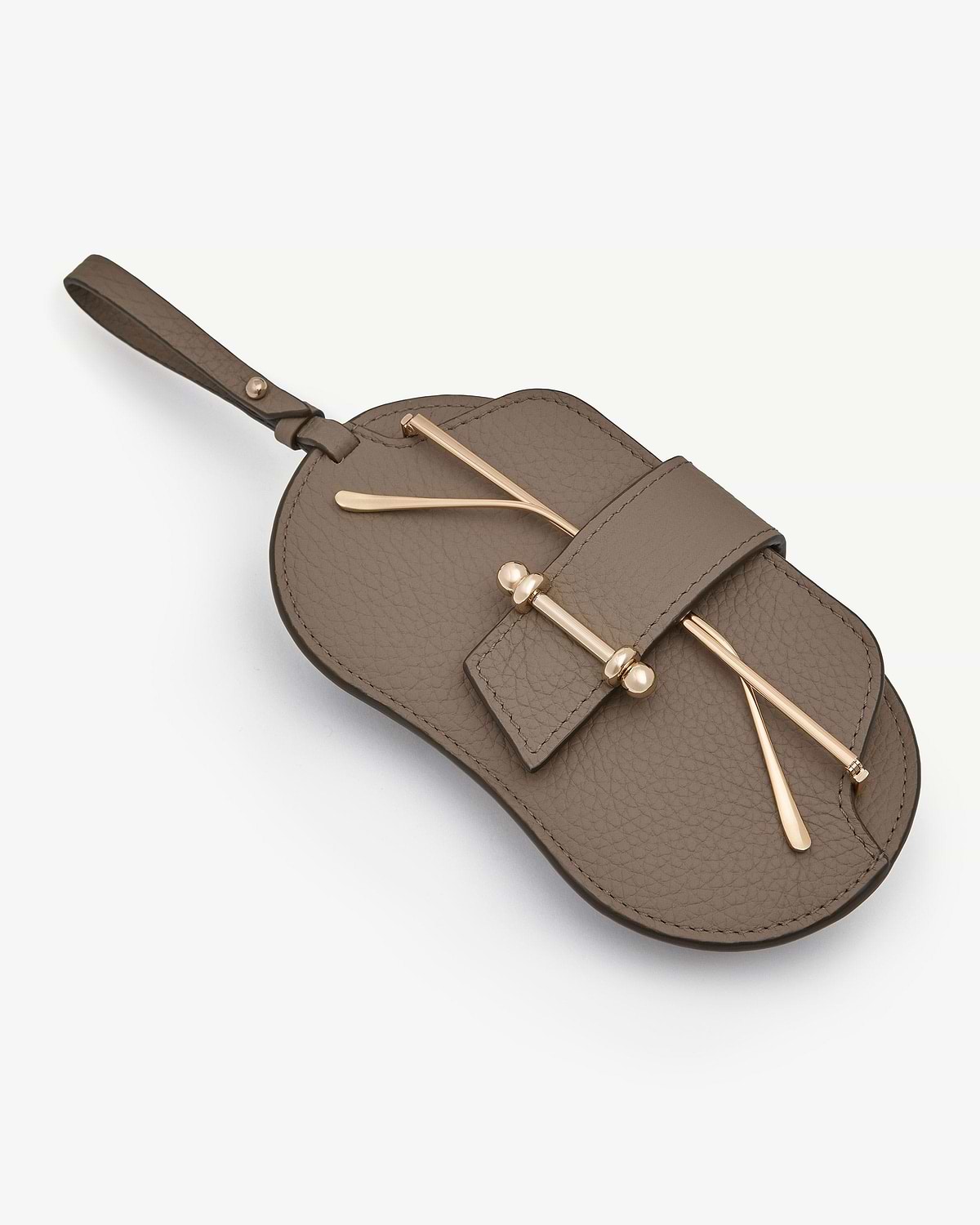 Taupe pebbled leather sunglasses case with gold hardware and wrist strap.