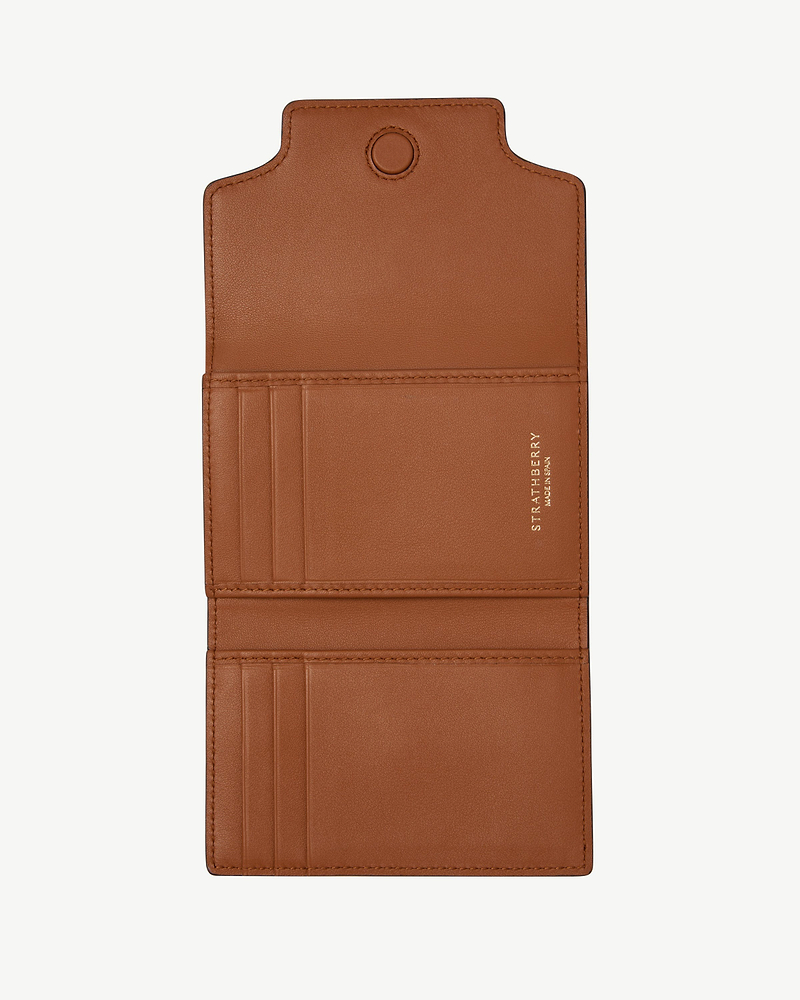 Strathberry Multrees trifold wallet in chestnut, open with multiple card slots