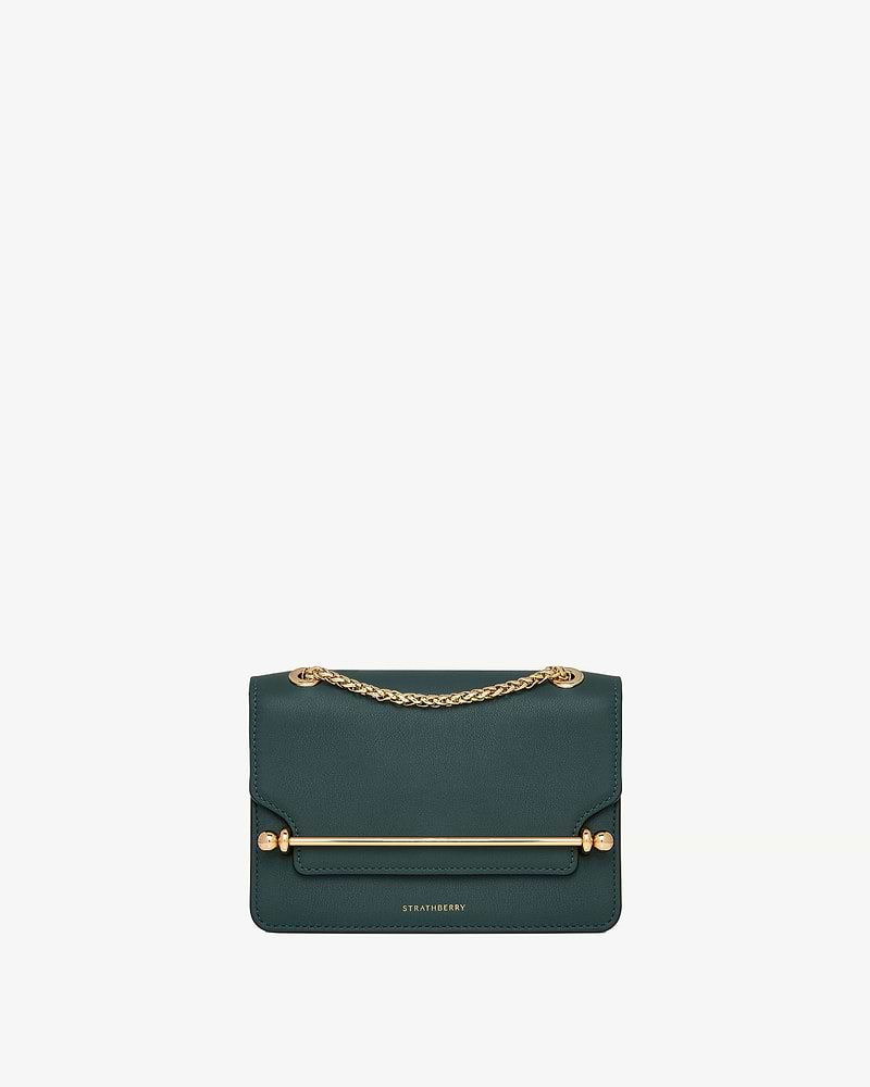 Bottle green East/West Mini bag with gold chain strap, bar hardware, Strathberry logo.