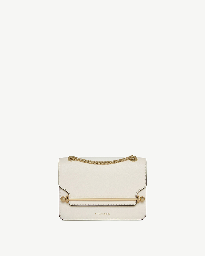Strathberry East/West mini bag in vanilla with gold bar and chain strap.