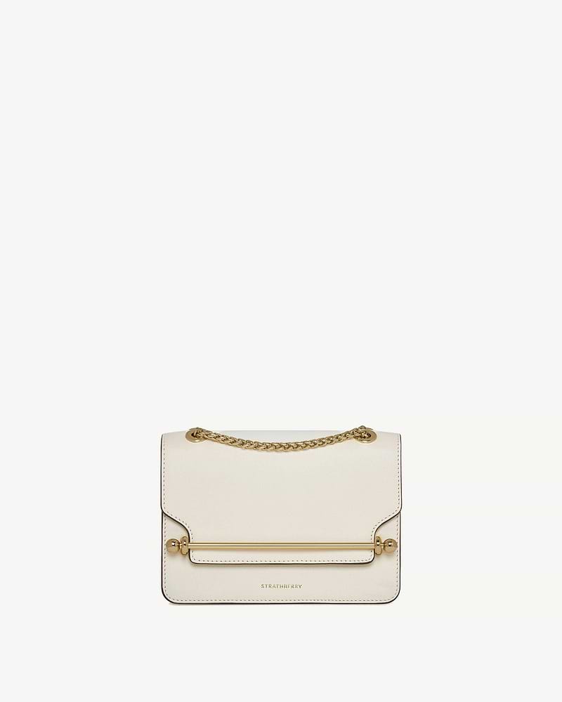 Strathberry East/West mini bag in vanilla with gold bar and chain strap.