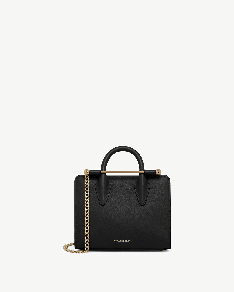 Black Strathberry nano tote with top handles, gold bar and chain strap.