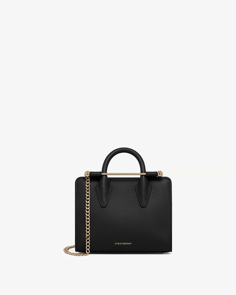 Black Strathberry nano tote with top handles, gold bar and chain strap.