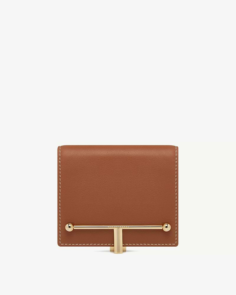 Chestnut leather wallet with vanilla contrast stitching and gold T-bar fastener