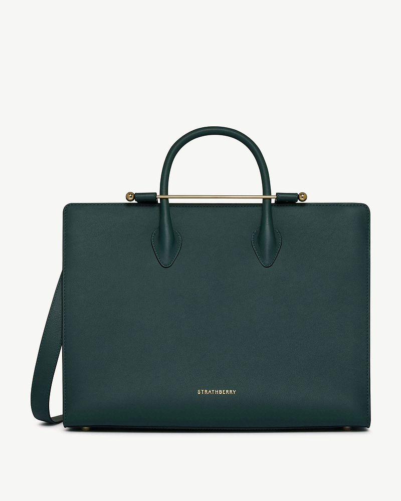 Bottle green leather tote with gold top bar, rounded handles and Strathberry logo.