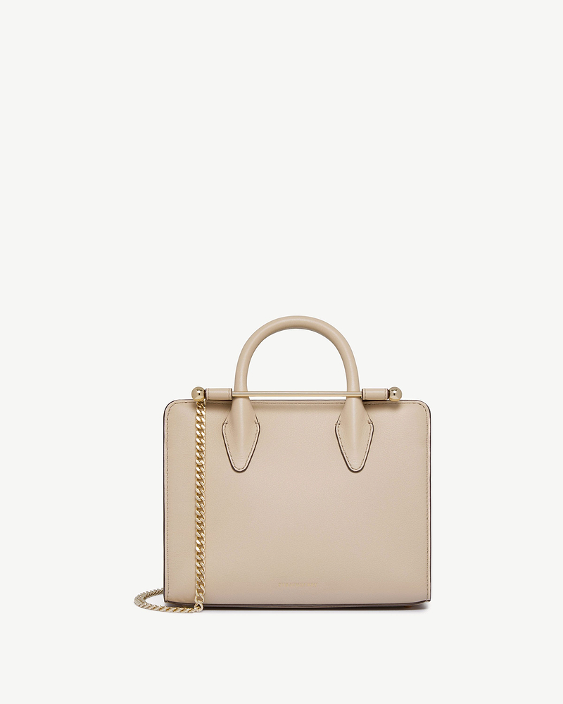 Strathberry mini tote in oat with top handles and gold chain strap