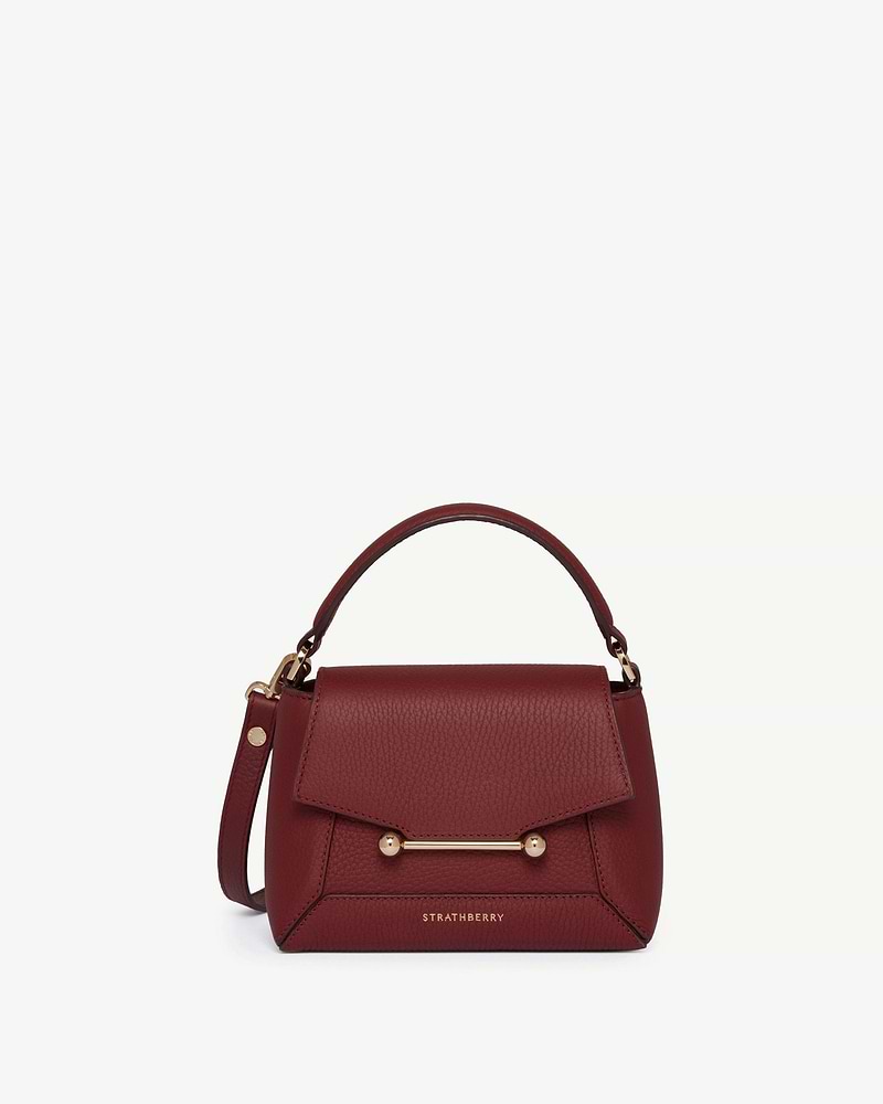 Oxblood Strathberry Mosaic Nano handbag with top handle and gold bar.