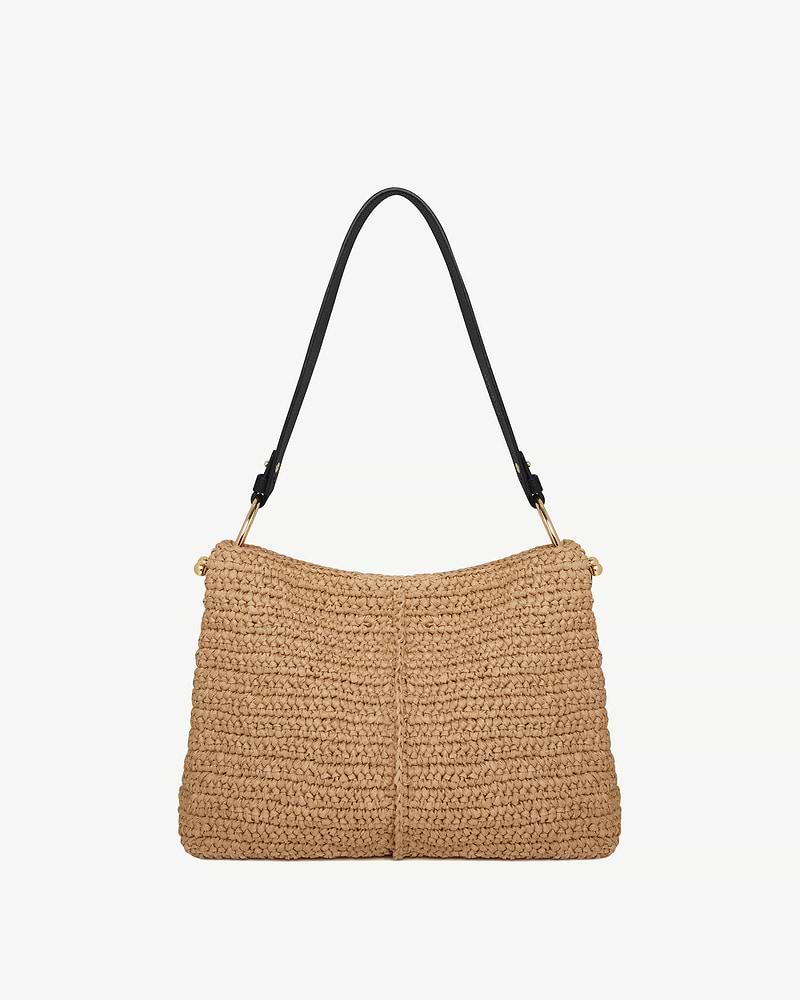 Raffia hobo bag with black shoulder strap and gold fittings