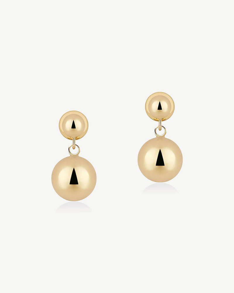 Pair of drop earrings with stacked 22 carat gold gilded spheres.