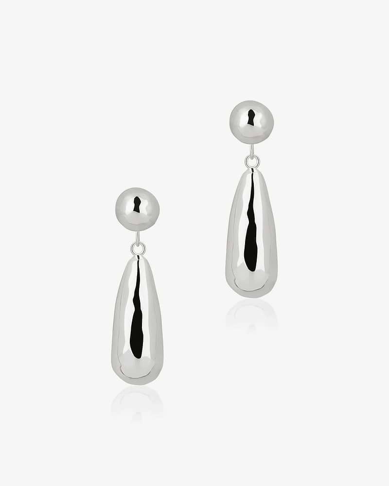 Pair of jasmine drop earrings in sterling silver on white background