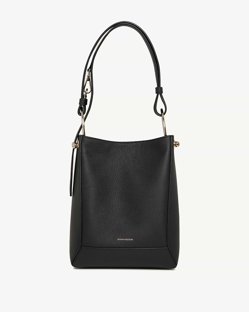 Black leather Strathberry Lana midi bucket bag with top handle and gold hardware