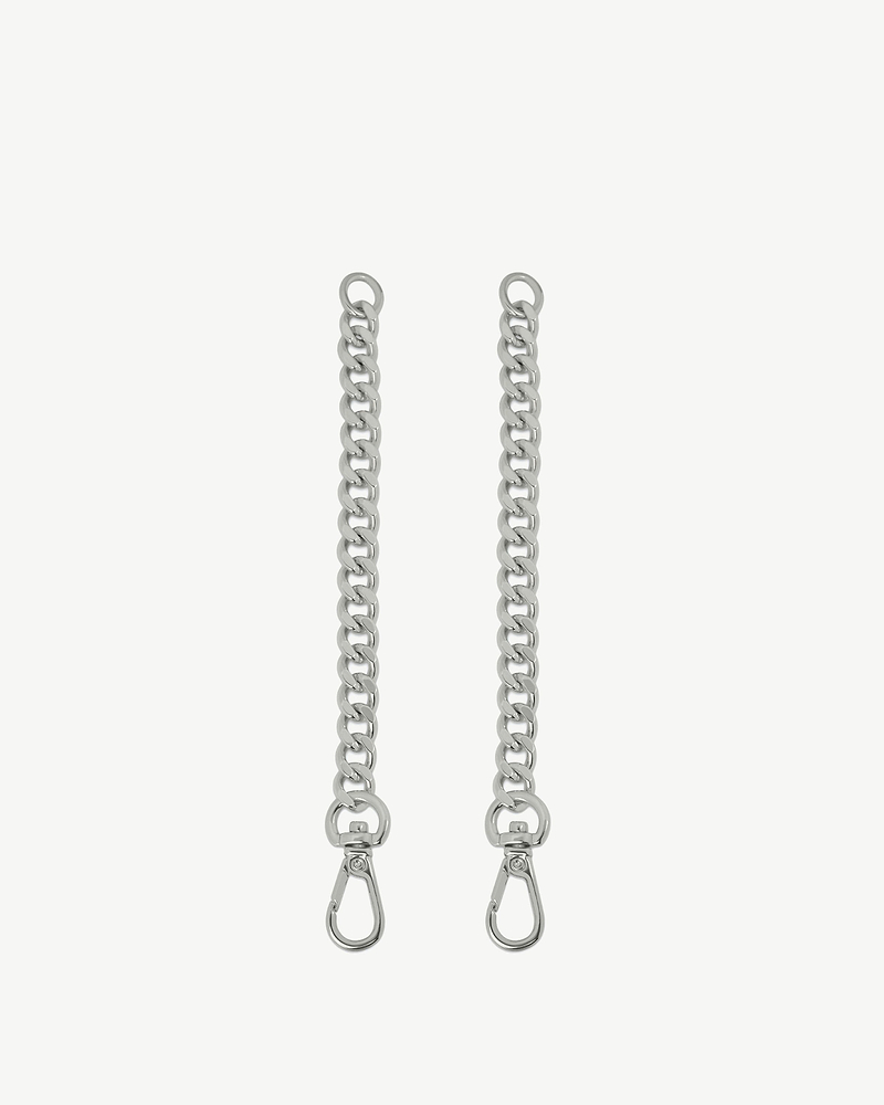 Two silver chain extenders with metal clasps on plain white background