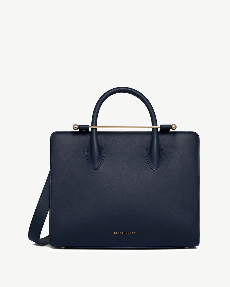 Marine blue midi tote with top handles, gold bar detail and Strathberry logo