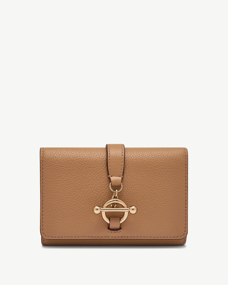 Caramel kite medium trifold wallet with textured leather and gold circular toggle closure.