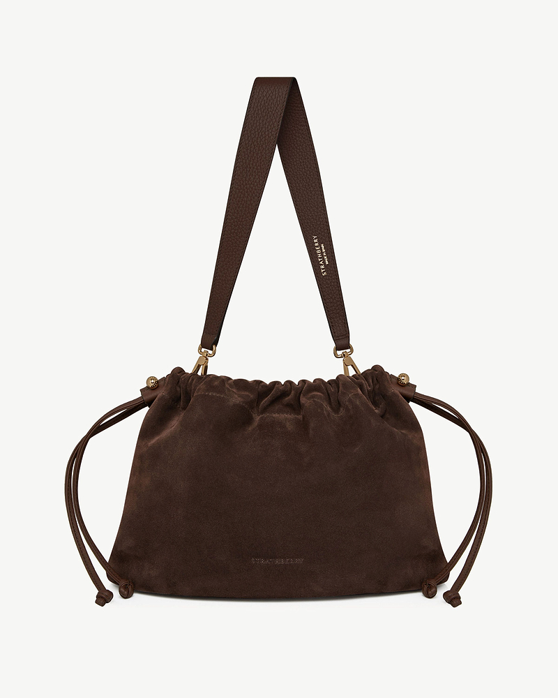 Strathberry chocolate suede Charlotte Midi drawstring bag with wide leather strap and gold hardware