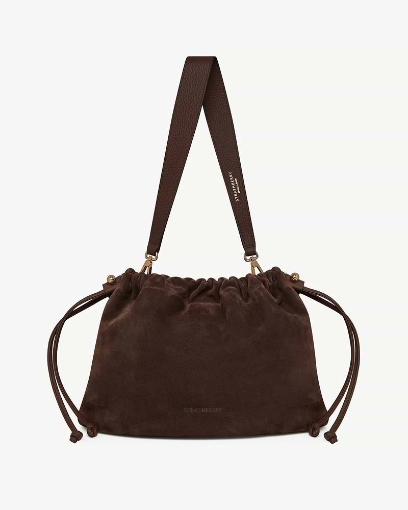 Strathberry chocolate suede Charlotte Midi drawstring bag with wide leather strap and gold hardware