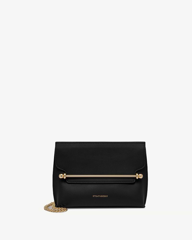 Black Strathberry Stylist Mini bag with gold bar detail and chain strap.