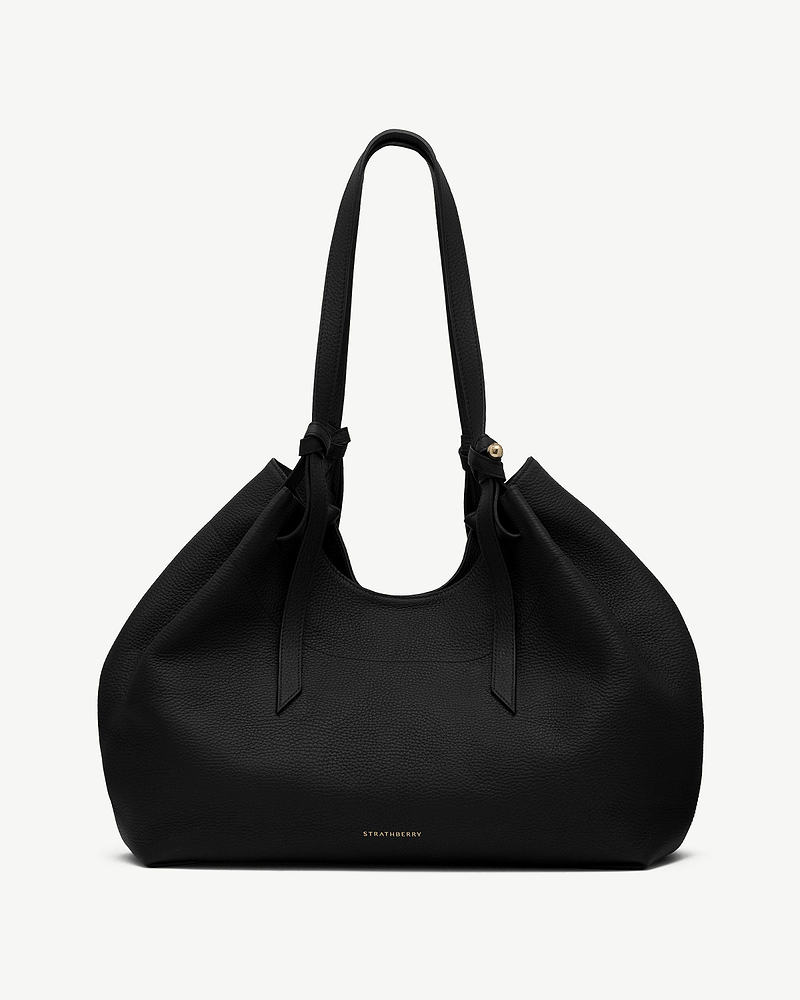 Black Strathberry Barra tote with pebbled leather, knotted handles, gold logo.