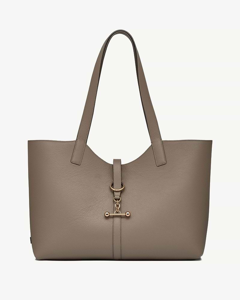 Taupe leather kite tote with long straps and gold T-bar clasp detail.
