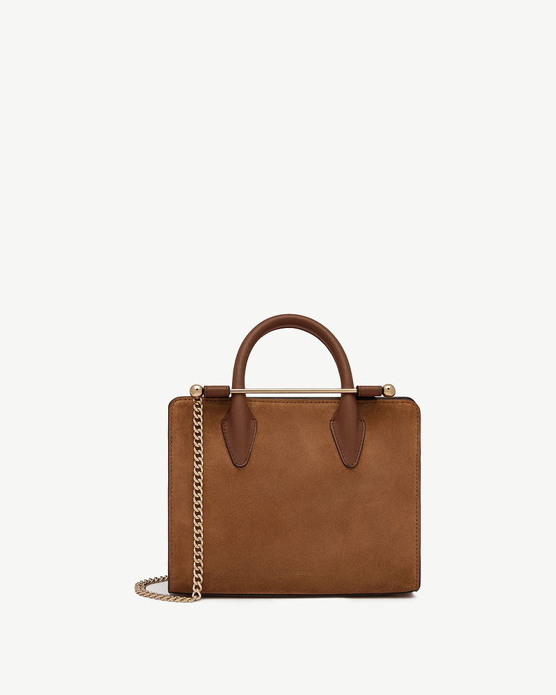 Tan suede mini tote with top handles and gold chain strap.